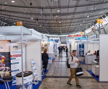 Exhibition stand spaces with visitors at Fastener Fair Global